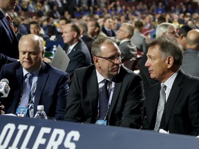 Ken Holland, right, Keith Gretzky, middle, and Bob Green, of the Edmonton Oilers attend the 2019 NHL Draft at Rogers Arena on June 22, 2019 in Vancouver.