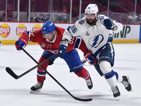 Canadiens’ Artturi Lehkonen (left) skates against Lightning right forward Nikita Kucherov in Game 4 on Monday.