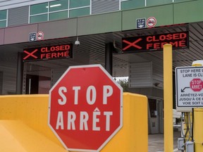 Two closed Canadian border checkpoints are seen after it was announced that the border would close to "non-essential traffic" to combat the spread of COVID-19 at the U.S.-Canada border crossing at the Thousand Islands Bridge in Lansdowne, Ont., March 19, 2020.