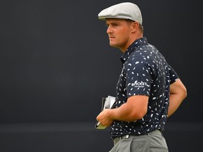Bryson DeChambeau pauses on the 18th green during his first round of the British Open at Royal St George's.