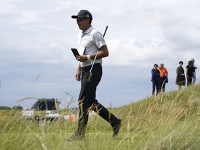 Rickie Fowler walks during a practice round at the Golf Open Championship, at the Royal St George's Golf Club in Sandwich, Kent, England, on Sunday,