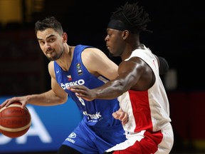 Canada's Luguentz Dort (right) defends against Czech Republic's Tomas Satoransky during the first half of Olympic Qualifying semifinal action on Saturday at Memorial Arena in Victoria.