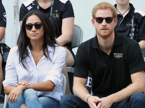 Prince Harry (R) and Meghan Markle (L) attend a Wheelchair Tennis match during the Invictus Games 2017 at Nathan Philips Square on September 25, 2017 in Toronto, Canada