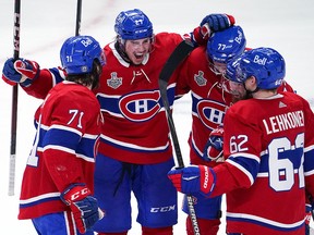 Alexander Romanov of the Montreal Canadiens is congratulated by his teammates after scoring against the Tampa Bay Lightning during Game 4 of the 2021 Stanley Cup Final at the Bell Centre on July 5, 2021 in Montreal.