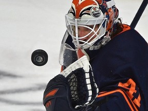 Edmonton Oilers goalie Mike Smith (41) makes a save against the Vancouver Canucks at Rogers Place in Edmonton on May 6, 2021.