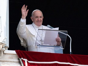 This handout picture taken and released by the Vatican Media on Sunday, July 4, 2021 shows Pope Francis delivering the Sunday Angelus prayer from the window of his study overlooking St. Peter's Square at the Vatican.