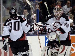 Buffalo Sabres goalie Ryan Miller leaves the net as Martin Biron replaces him in a 2006 game.