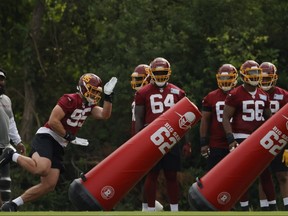 Washington Football Team defensive end Casey Toohill runs around blocking dummies during drills as part of minicamp at Inova Sports Performance Center in Ashburn, Va., June 10, 2021.