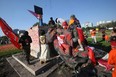 A group not protesters damaged statues of Queen Victoria and Queen Elizabeth in Winnipeg on July 1, 2021.