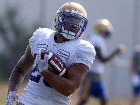Running back Brady Oliveira lugs the ball at Blue Bombers training camp on July 14, 2021.
