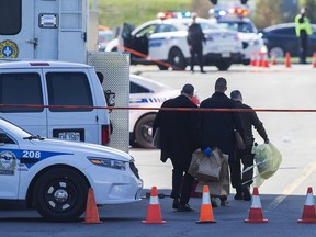 Investigators collect evidence from the Sheraton Laval Hotel on May 5, 2019, after Salvatore Scoppa was shot and killed there.