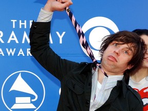 In this file photo, singer Ryan Adams arrives at the 44th Annual Grammy Awards in Los Angeles, Calif., Feb. 27, 2002.