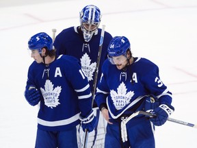 Toronto Maple Leafs forward Auston Matthews (34) and teammates Mitchell Marner (16) and Jack Campbell (36) skate off in dejection at the end of third period NHL Stanley Cup hockey action against the Montreal Canadiens, in Toronto, Monday, May 31, 2021. (Nathan Denette, The Canadian Press)