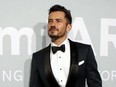 Orlando Bloom poses as he attends the 74th Cannes Film Festival in Antibes, France, July 16, 2021.