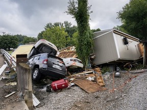 Flood damage is left as a result of severe weather in Waverly, Tenn., Sunday, Aug. 22, 2021. The downpours rapidly turned the creeks that run behind backyards and through downtown Waverly into raging rapids.