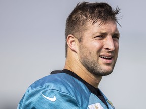 Tim Tebow of the Jacksonville Jaguars looks on during Training Camp at TIAA Bank Field on July 30, 2021 in Jacksonville, Fla.