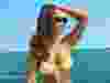 Hailie Jade Mathers posing in bikini on boat.