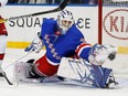 New York Rangers goaltender Henrik Lundqvist makes a glove save against the Carolina Hurricanes during the first period at Madison Square Garden.