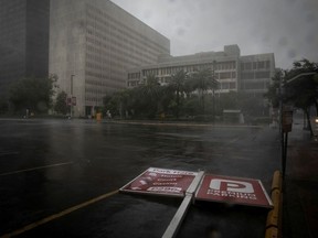 A parking sign lies in the street as Hurricane Ida makes landfall in Louisiana, in New Orleans, Louisiana, U.S. August 29, 2021.