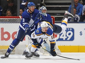 Winger Zach Sanford, front, seen here in a Blues game against the Maple Leafs in 2019, played U.S. college hockey with Senators centre Colin White.