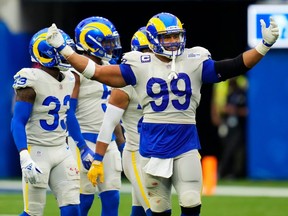 Rams defensive lineman Aaron Donald is all smiles as he gestures to the crowd during Sunday's win over Tampa Bay.