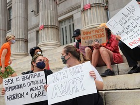 People gather for a reproductive rights rally at Brooklyn Borough Hall in New York City, Wednesday, Sept. 1, 2021.