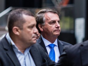 Brazil's President Jair Bolsonaro walks outside his hotel while attending the UN General Assembly 76th session General Debate at the United Nations, in New York City, Sept. 20, 2021.