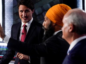 Liberal Leader Justin Trudeau, left to right, NDP Leader Jagmeet Singh, and Conservative Leader Erin O'Toole take part in the federal election English-language Leaders debate in Gatineau September 9, 2021. Adrian Wyld/Pool via REUTERS