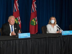 Ontario Premier Doug Ford, second left, responds to a question as Dr. Kieran Moore, Chief Medical Officer of Health, Christine Elliott, Deputy Premier and Minister of Health, and Kaleed Rasheed, Associate Minister of Digital Government, listen, during a press conference at Queen's Park in Toronto on Wednesday, September 1, 2021. THE CANADIAN PRESS/ Tijana Martin ORG XMIT: TIJ101