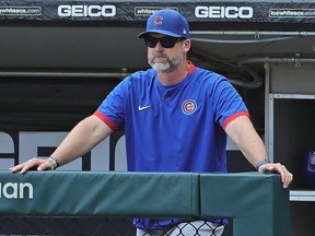 Cubs manager David Ross watches as his team takes on the White Sox at Guaranteed Rate Field in Chicago, Aug. 29, 2021.