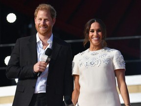 Britain's Prince Harry and Meghan Markle speak during the 2021 Global Citizen Live festival at the Great Lawn, Central Park on September 25, 2021 in New York City.