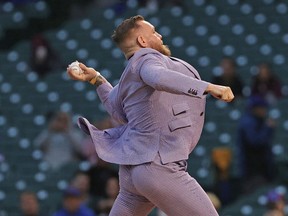 Conor McGregor throws out a ceremonial first pitch before the Chicago Cubs took on the Minnesota Twins at Wrigley Field on September 21, 2021 in Chicago.