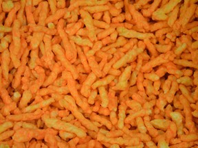 Shots of crunchy cheese puffs close up