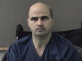 In this photo released by the Bell County Sheriff's Office, U.S. Maj. Nidal Hasan, the Army psychiatrist who murdered 13 in the Fort Hood shooting, is seen in a booking photo on April 9, 2010 in Belton, Texas.