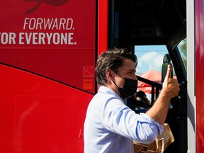 Canada's Liberal Prime Minister Justin Trudeau gives a thumbs up after an election campaign stop in Blainville, Que. on Thursday, Sept. 16, 2021.