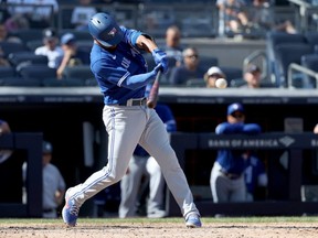 Blue Jays batter Marcus Semien hits a grand slam in the top of the ninth inning against the Yankees at Yankee Stadium in New York City, Sunday, Sept. 6, 2021.