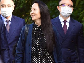 Huawei Chief Financial officer Meng Wanzhou leaves her Vancouver home to attend her extradition hearing, Sept. 24, 2021, in Vancouver.