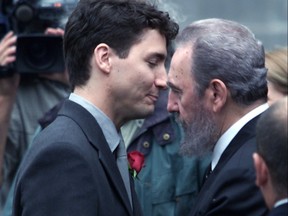 Justin Trudeau gets a hug from Cuban President Fidel Castro in front of Notre Dame Church prior to the funeral of Pierre Trudeau Oct 3, 2000.