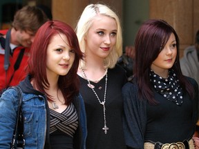 British actresses Meghan, left, and Kathryn Prescott, right, with Lily Loveless, centre, arrive in London's Leicester Square, on June 10, 2009 to attend the British Premiere of The Hangover.