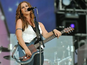 In this file photo taken on June 27, 2008 Canadian singer Alanis Morissette performs on stage at the Rock in Rio Madrid music festival in Arganda del Rey near Madrid.