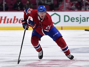 Canadiens forward Christian Dvorak chases the puck against the Toronto Maple Leafs during the second period at the Bell Centre on Sept. 27, 2021.