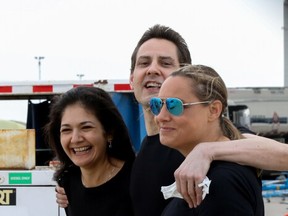 After nearly three years of detention in China, Michael Kovrig, his wife Vina Nadjibulla (left) and sister Ariana Botha (right) were overjoyed following the former diplomat's arrival on a Canadian air force jet at Pearson International Airport in Toronto, Ontario, Canada, on Sept. 25, 2021.