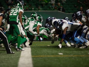 The Saskatchewan Roughriders defence makes a goal line stand against the Toronto Argonauts, stopping John White IV on third and goal from the one on Friday night at Mosaic Stadium in Regina.