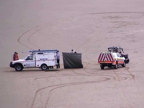 New South Wales (NSW) Ambulance are pictured at Shelly Beach where a surfer was fatally attacked by a shark on Sunday.