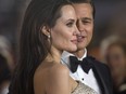 Director and cast member Angelina Jolie and her husband and co-star Brad Pitt pose at the premiere of "By the Sea" during the opening night of AFI FEST 2015 in Hollywood, California November 5, 2015.