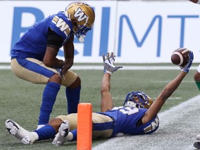 Winnipeg Blue Bombers WR Kenny Lawler (right) celebrates his touchdown catch against the Saskatchewan Roughriders during the Banjo Bowl in Winnipeg with Rasheed Bailey on Saturday, Sept. 11, 2021.