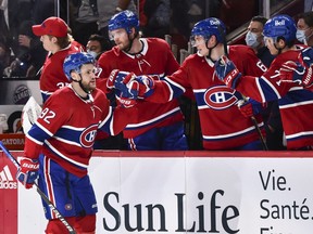 Canadiens' Jonathan Drouin (92) celebrates his goal with teammates on the bench against the New York Rangers during the third period at the Centre Bell on Saturday, Oct. 16, 2021, in Montreal.