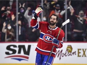 The Canadiens' Mathieu Perreault, who was born and raised in Drummondville, waves to fans at Bell Centre after scoring three goals and being named the first star of 6-1 win over the Detroit Red Wings Saturday night.