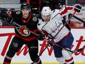 Ottawa Senators' Alex Formenton (10) battles with Washington Capitals right winger Daniel Sprong at the Canadian Tire Centre on Monday night.