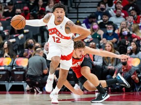 Raptors forward Ish Wainright moves the ball up the court against the Rockets in pre-season action. Wainright will find out in the next week if he’s made the team.